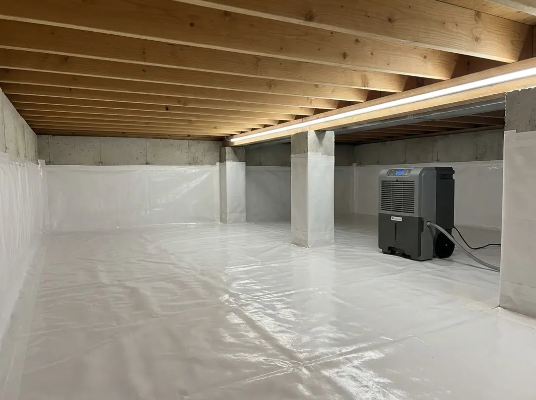 Bright dry encapsulated crawl space with white Viper CS vapor barrier